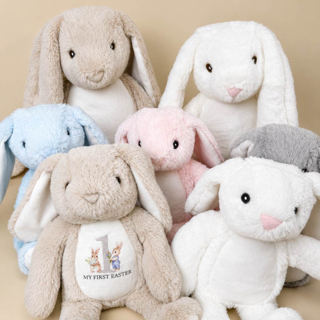 Set of plush bunny toys in various colors on a beige background